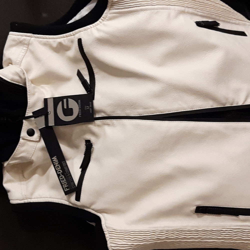 It's all white fried  Denim Is a white vest size medium